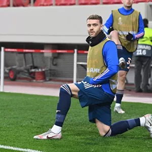 Arsenal's Calum Chambers in Europa League Action against Olympiacos in Greece Amidst Empty Stands (Olympiacos v Arsenal 2021)