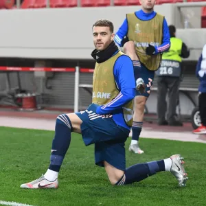Arsenal's Calum Chambers in Europa League Action against Olympiacos in Greece Amidst Empty Stands (Olympiacos v Arsenal 2021)