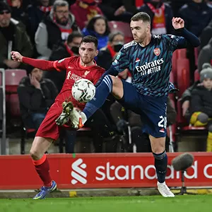 Arsenal's Calum Chambers Faces Pressure from Liverpool's Andrew Robertson in Carabao Cup Semi-Final Clash
