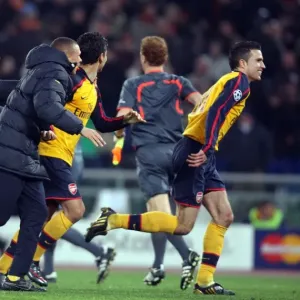 Arsenal's Champions League Victory: Robin van Persie and Team Celebrate Penalty Shootout Win Against AS Roma