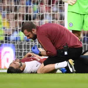 Arsenal's Chris Morgan Tends to Injured Sead Kolasinac during Arsenal v Chelsea Pre-Season Friendly (2018-19) Arsenal's Chris Morgan Tends to Injured Sead Kolasinac during Arsenal v Chelsea Pre-Season Friendly (2018-19)