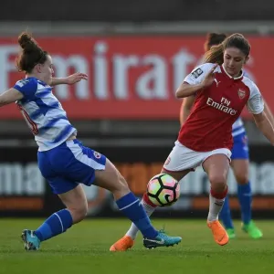 Arsenal's Danielle van de Donk Outmaneuvers Reading's Lauren Bruton in WSL Action Arsenal's Danielle van de Donk Outmaneuvers Reading's Lauren Bruton in WSL Action
