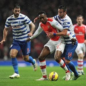 Arsenal's Danny Welbeck Clashes with Mauricio Isla of QPR during Premier League Match