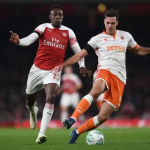 Arsenal's Danny Welbeck Closes In on Blackpool's Ben Heneghan in Carabao Cup Showdown