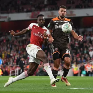 Arsenal's Danny Welbeck Faces Off Against Brentford's Ezri Konsa in Carabao Cup Clash