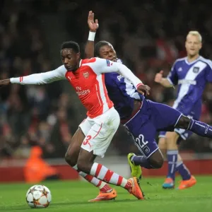 Arsenal's Danny Welbeck Fouled by Chancel Mbemba, Awarding a Penalty in UEFA Champions League Match against Anderlecht Arsenal's Danny Welbeck Fouled by Chancel Mbemba, Awarding a Penalty in UEFA Champions League Match against Anderlecht