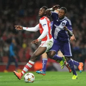 Arsenal's Danny Welbeck Fouled by Chancel Mbemba in UEFA Champions League Match against Anderlecht Arsenal's Danny Welbeck Fouled by Chancel Mbemba in UEFA Champions League Match against Anderlecht