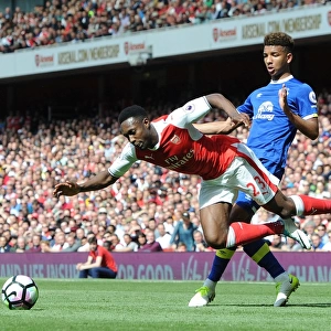 Arsenal's Danny Welbeck Fouled by Everton's Mason Holgate in Intense Premier League Clash