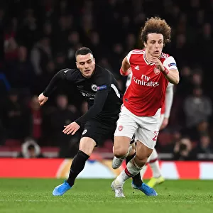 Arsenal's David Luiz Battles Past Eintracht Frankfurt's Filip Kostic in Europa League Clash