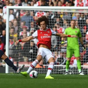 Arsenal's David Luiz Evades Pressure from Bournemouth's Callum Wilson During Premier League Clash Arsenal's David Luiz Evades Pressure from Bournemouth's Callum Wilson During Premier League Clash