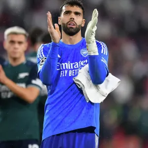 Arsenal's David Raya: Celebrating with Fans after Securing Champions League Victory over Sevilla Arsenal's David Raya: Celebrating with Fans after Securing Champions League Victory over Sevilla