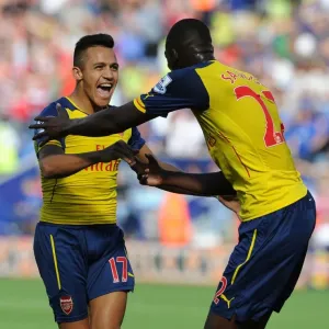 Arsenal's Deadly Duo: Sanchez and Sanogo Celebrate Goal Against Leicester City (2014-15)