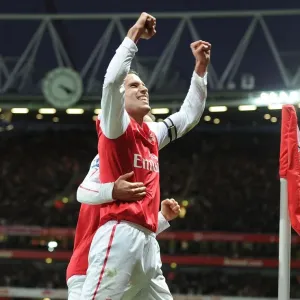 Arsenal's Deadly Duo: Van Persie and Ramsey Celebrate Historic Goal (2011-12)