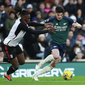 Arsenal's Declan Rice Fends Off Fulham's Calvin Bassey in Premier League Clash (Fulham v Arsenal 2023-24) Arsenal's Declan Rice Fends Off Fulham's Calvin Bassey in Premier League Clash (Fulham v Arsenal 2023-24)