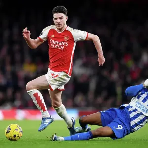 Arsenal's Declan Rice Outruns Brighton's Joao Pedro in 2023-24 Premier League Clash