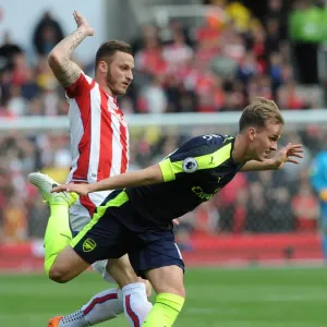 Arsenal's Dominance: Rob Holding Scores Against Marko Arnautovic as Arsenal Thrash Stoke 4-1 in Premier League