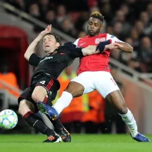 Arsenal's Dominant Performance: 3-0 Over AC Milan in Champions League Round of 16 (Alex Song vs Mark van Bommel) Arsenal's Dominant Performance: 3-0 Over AC Milan in Champions League Round of 16 (Alex Song vs Mark van Bommel)