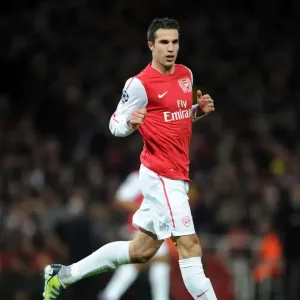 Arsenal's Dominant Performance: Robin van Persie Scores Three as Arsenal Crushes AC Milan 3-0 in UEFA Champions League