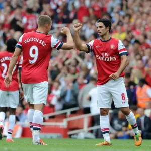 Arsenal's Dominant Performance: Lukas Podolski and Mikel Arteta Star in 6-1 Victory over Southampton (Premier League, 2012-13) Arsenal's Dominant Performance: Lukas Podolski and Mikel Arteta Star in 6-1 Victory over Southampton (Premier League, 2012-13)