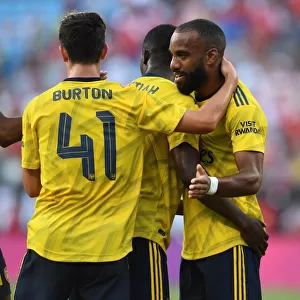 Arsenal's Double Act: Nketiah and Lacazette Celebrate Goals Against Fiorentina in 2019 International Champions Cup
