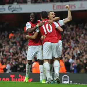 Arsenal's Double Strike: Vermaelen, Van Persie, Gervinho, and Walcott Celebrate Goals Against West Bromwich Albion (2011-12)