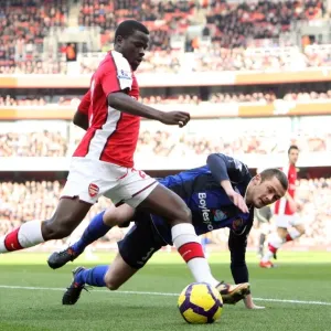 Arsenal's Eboue and McCartney Clash in Arsenal's 2-0 Victory over Sunderland in the Premier League, 20/2/10
