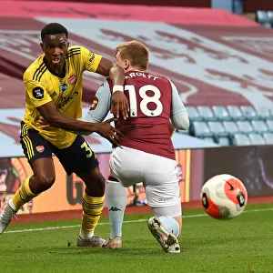 Arsenal's Eddie Nketiah Clashes with Aston Villa's Matt Targett in Premier League Showdown