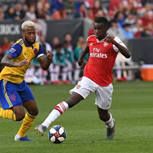 Arsenal's Eddie Nketiah Clashes with Colorado's Kellyn Acosta during the 2019-20 Pre-Season Match