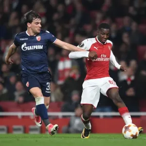 Arsenal's Eddie Nketiah Clashes with Crvena Zvezda's Filip Stocjkovic in Europa League Showdown
