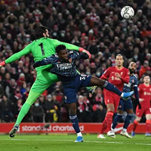 Arsenal's Eddie Nketiah Clashes with Liverpool's Alisson in Carabao Cup Semi-Final