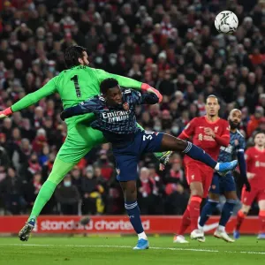 Arsenal's Eddie Nketiah Clashes with Liverpool's Alisson in Carabao Cup Semi-Final