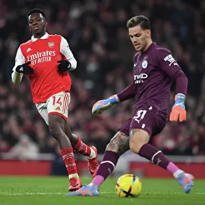 Arsenal's Eddie Nketiah Closes In on Manchester City's Ederson in Intense Premier League Clash