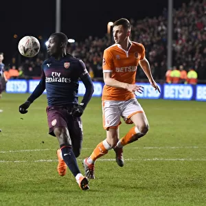 Arsenal's Eddie Nketiah Fends Off Blackpool's Jimmy Ryan in FA Cup Clash