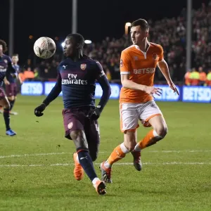 Arsenal's Eddie Nketiah Fends Off Blackpool's Jimmy Ryan in FA Cup Clash