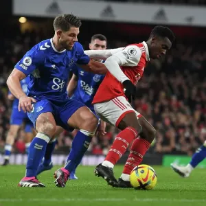 Arsenal's Eddie Nketiah Fends Off Everton's James Tarkowski in Intense Premier League Clash