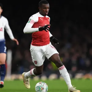 Arsenal's Eddie Nketiah Goes Head-to-Head with Tottenham in Carabao Cup Showdown Arsenal's Eddie Nketiah Goes Head-to-Head with Tottenham in Carabao Cup Showdown