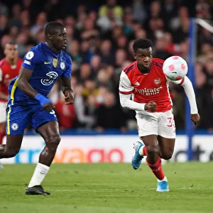 Arsenal's Eddie Nketiah Outmaneuvers Chelsea's Malang Sarr in Premier League Clash