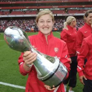 Arsenal's Ellen White Celebrates WSL Title with Trophy Amidst Arsenal's 1:0 Premier League Victory over Swansea City
