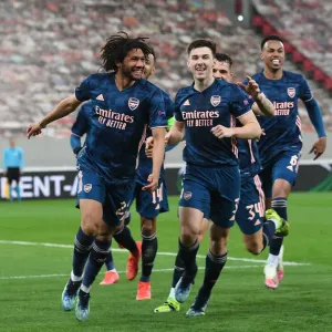 Arsenal's Elneny and Tierney Celebrate Goals in Empty Olympiacos Stadium, Europa League Round of 16