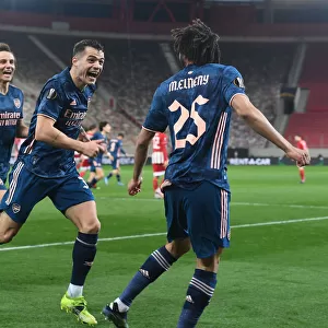 Arsenal's Elneny and Xhaka Celebrate Goals in Empty Karaiskakis Stadium during Olympiacos Clash in Europa League
