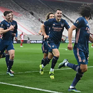Arsenal's Elneny, Xhaka, and Tierney Celebrate Goals in Empty Karaiskakis Stadium during Olympiacos vs Arsenal, UEFA Europa League Round of 16 (March 11, 2021)