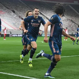 Arsenal's Elneny, Xhaka, and Tierney Celebrate Goals in Empty Karaiskakis Stadium during Olympiacos vs Arsenal, UEFA Europa League Round of 16 (March 11, 2021)