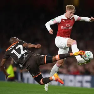 Arsenal's Emile Smith Rowe Clashes with Brentford's Kamohelo Mokotjo in Carabao Cup Showdown