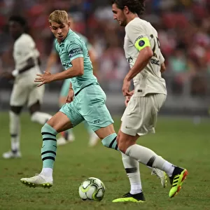 Arsenal's Emile Smith Rowe Clashes with Paris Saint-Germain's Adrien Rabiot in Pre-Season Friendly