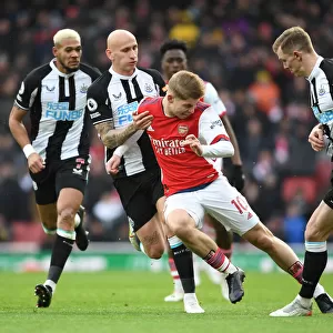 Arsenal's Emile Smith Rowe Faces Off Against Newcastle's Shelvey and Krafth in Premier League Clash