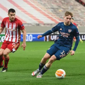 Arsenal's Emile Smith Rowe Faces Off Against Olympiacos Sokratis in Empty Europa League Stadium