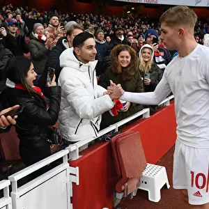Arsenal's Emile Smith Rowe Greets Fans with Shirt after Arsenal v Newcastle United Match (2021-22)