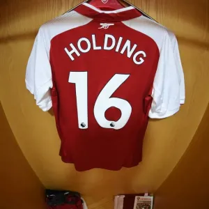 Arsenal's Emirates Stadium: Rob Holding's Shirt in the Home Changing Room Before Arsenal vs Leicester City (2017-18) Arsenal's Emirates Stadium: Rob Holding's Shirt in the Home Changing Room Before Arsenal vs Leicester City (2017-18)