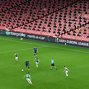 Arsenal's Emirates Stadium: A Ghostly Arena in UEFA Europa League Match Against Rapid Wien Amidst Pandemic Restrictions