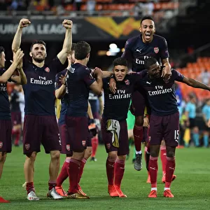 Arsenal's Europa League Victory: Ozil, Kolasinac, Torreira, Aubameyang, and Maitland-Niles Celebrate in Valencia